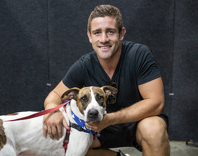 RSPCA Ambassador Andrew McCullough with a Dog at Pop Up Adoption